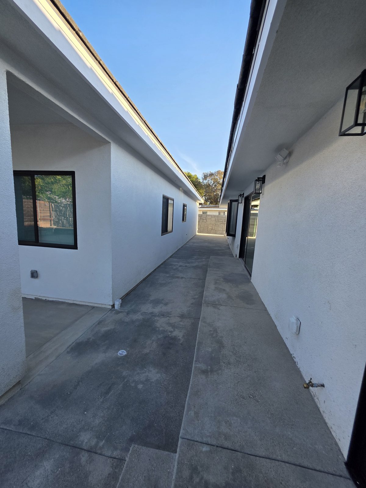 New concrete walkway between the ADU and the main house