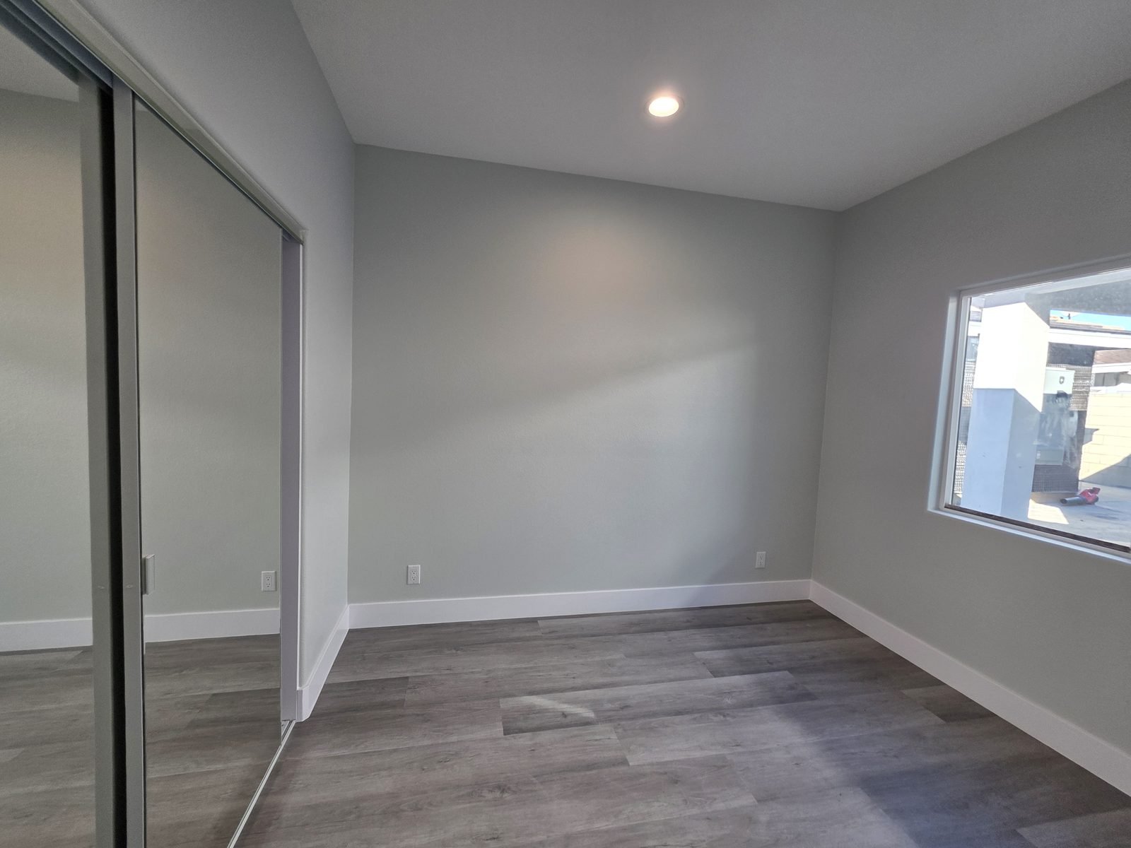 Bedroom with mirrored closet doors in a new SB9 home